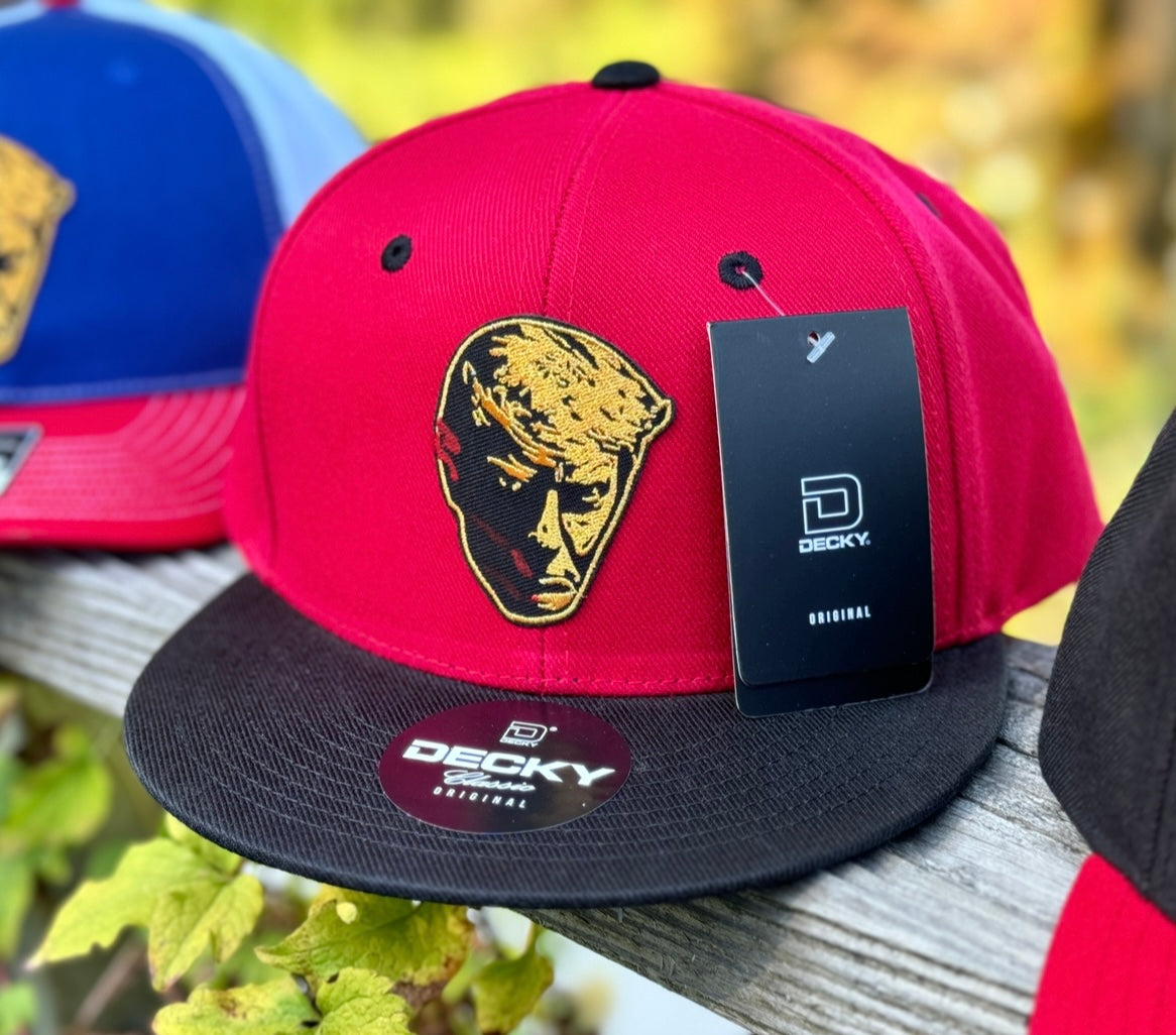 203. Trump Bloody Mugshot - embroidered metallic gold patch on Red/Black Decky 6 panel flat bill snapback